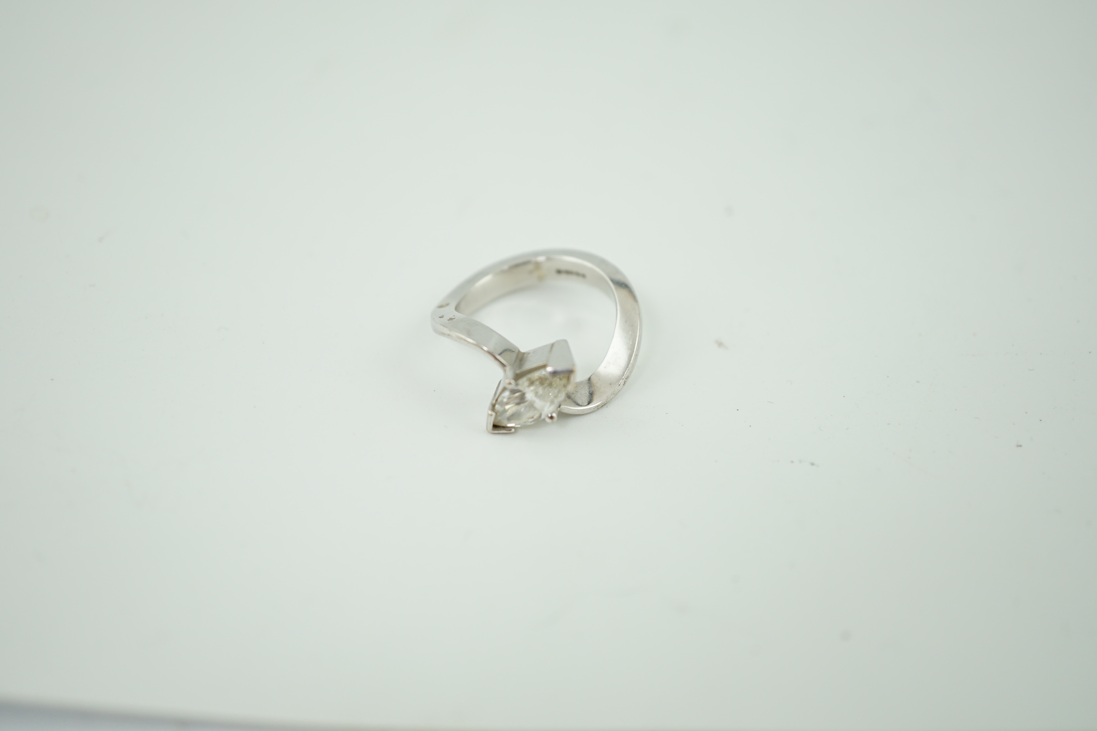 A modern 18ct white gold and solitaire marquise cut diamond set ring